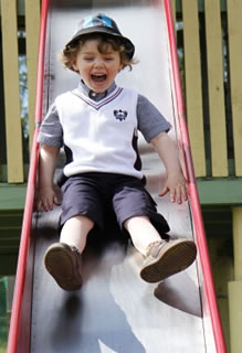 Boy playing on slide